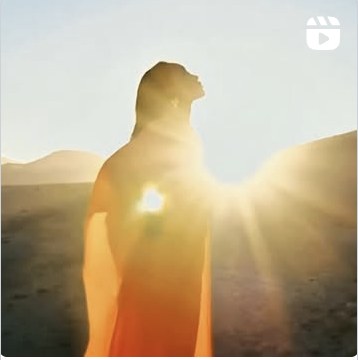 AUTHOR silhouetted in golden desert light