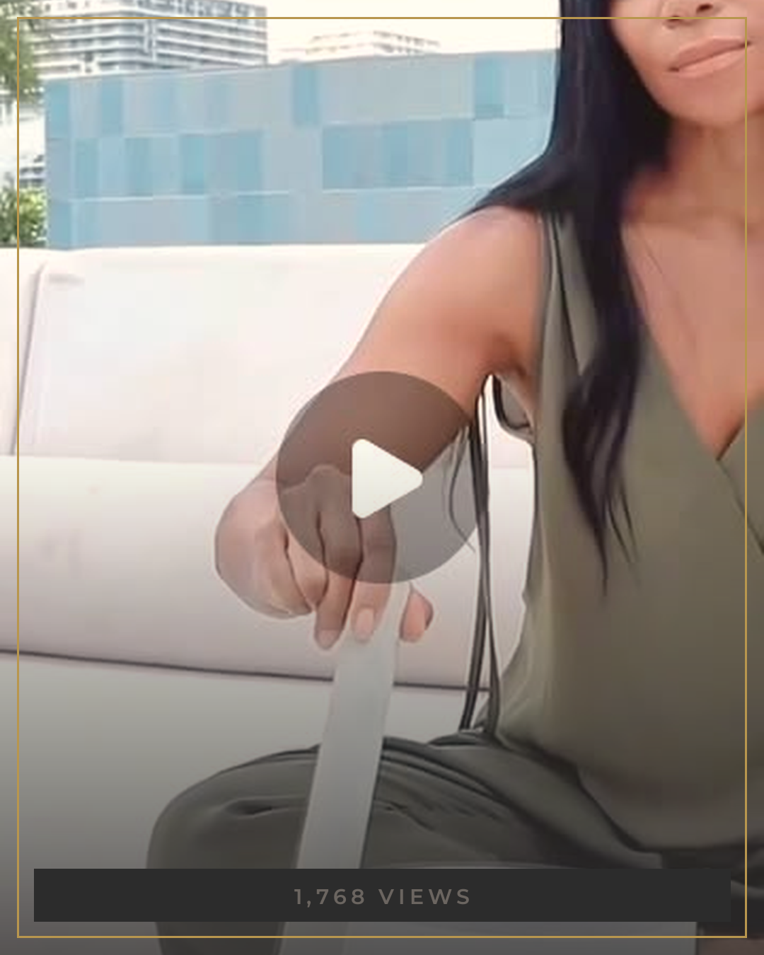 AUTHOR playing a crystal singing bowl outdoors in olive linen